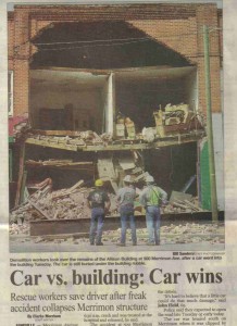 Photo of magazine article about a building that a car drove into that needed to be destroyed