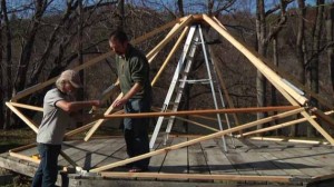 Team nearing completion installing frame of Yome home yurt alternative tent living shelter