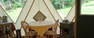 Dining area in a well kept tent home hybrid of tipi, yurt and dome