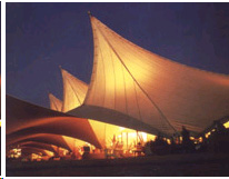 Large tensile structure seen glowing at night lit from within